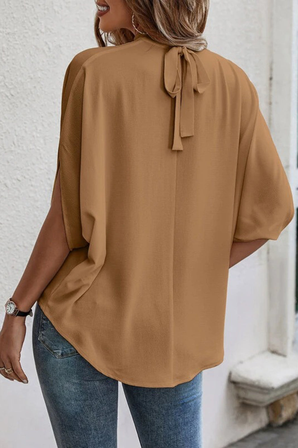 Back view of a model wearing an Exquisite Women's Camel Tie Back Slit Half Sleeve Blouse