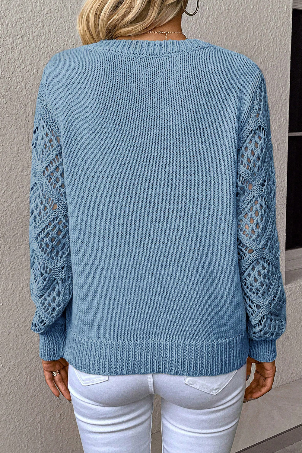 Model from behind wearing a light Blue Women's Pointelle Knit V-Neck Sweater with open lace sleeves.