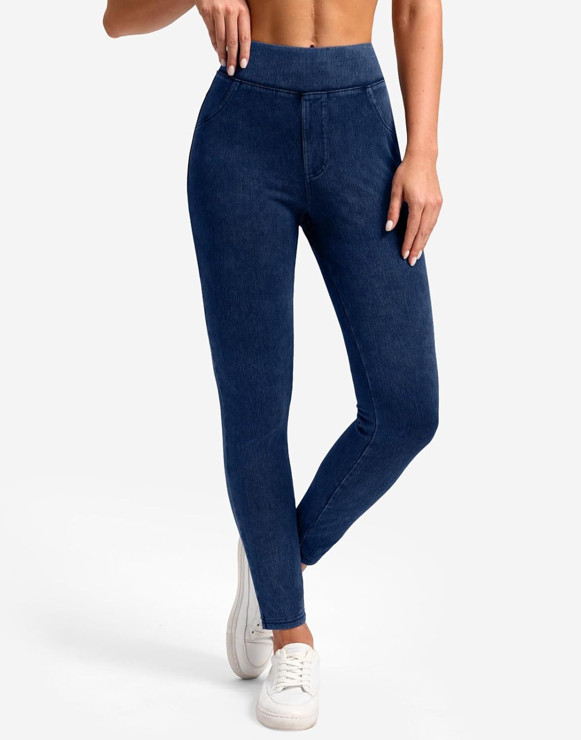 Blue leggings worn by a person on a white background