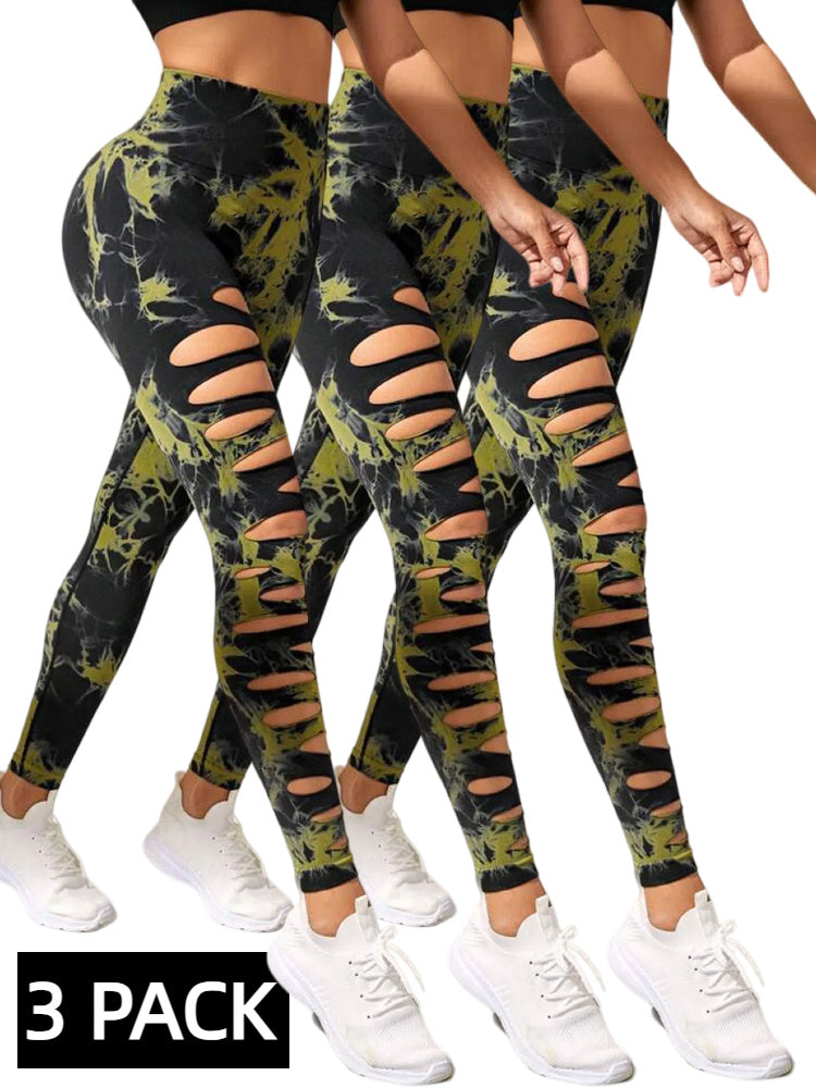 Three pairs of tie-dye leggings with distressed details on a white background.