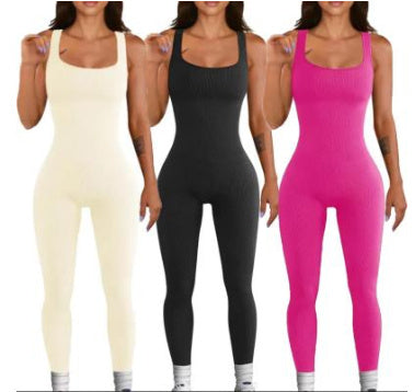 Three women wearing sleeveless jumpsuits in beige, black, and pink.