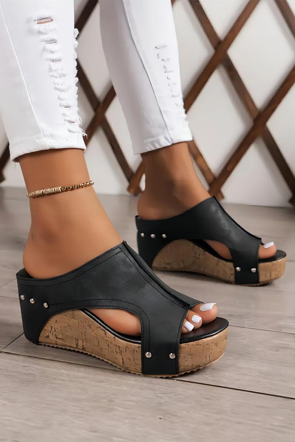 Black wedge sandals with cork sole side view