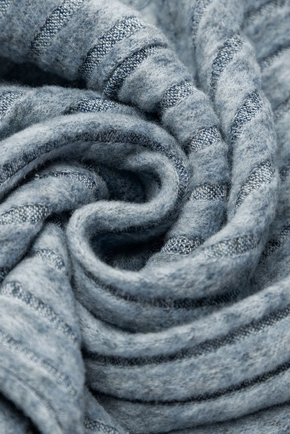 Close-up of textured blue fabric with a subtle pattern
