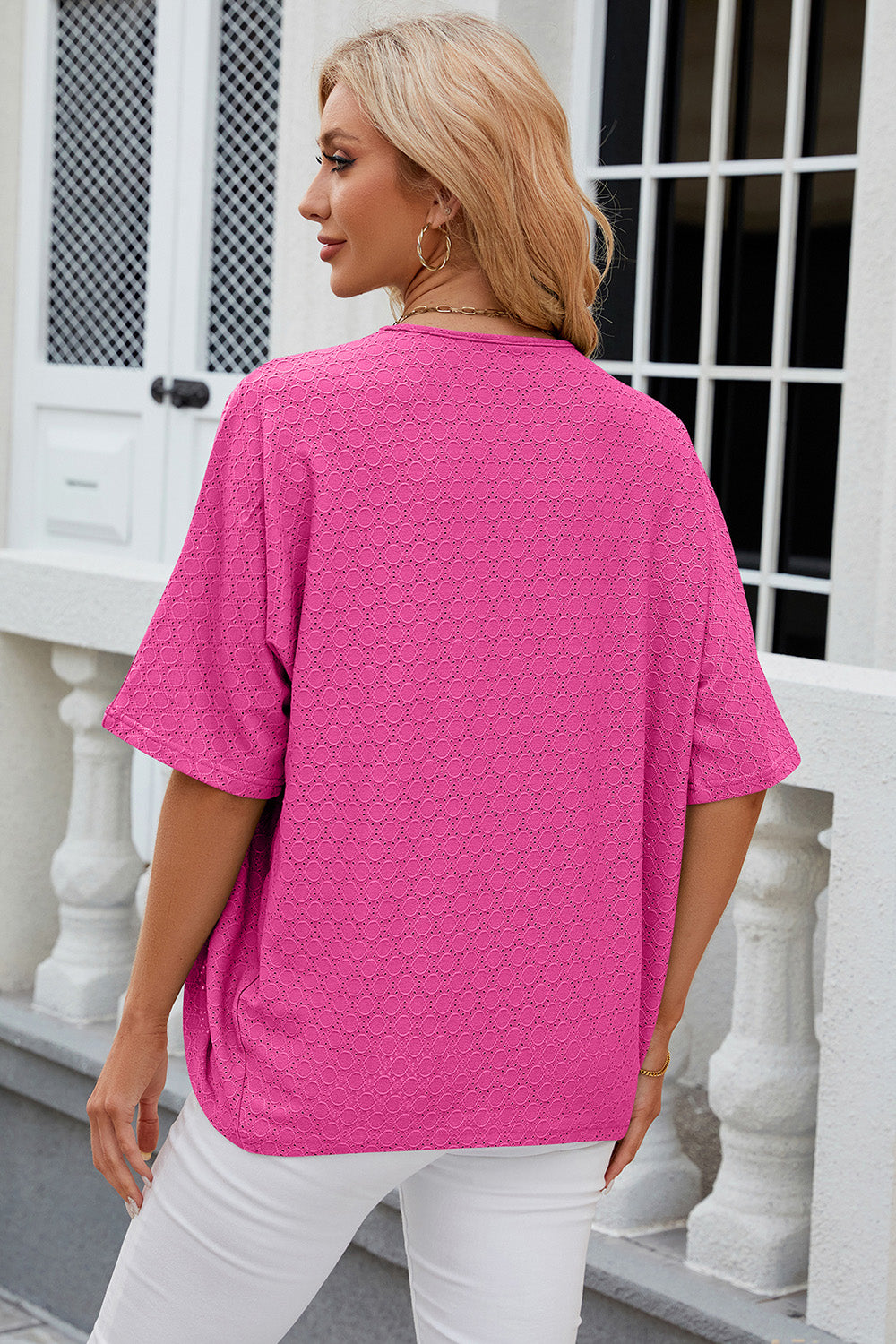 Back view of a model wearing a HOT PINK Chic Ladies Eyelet Open Front Half Sleeve Cardigan