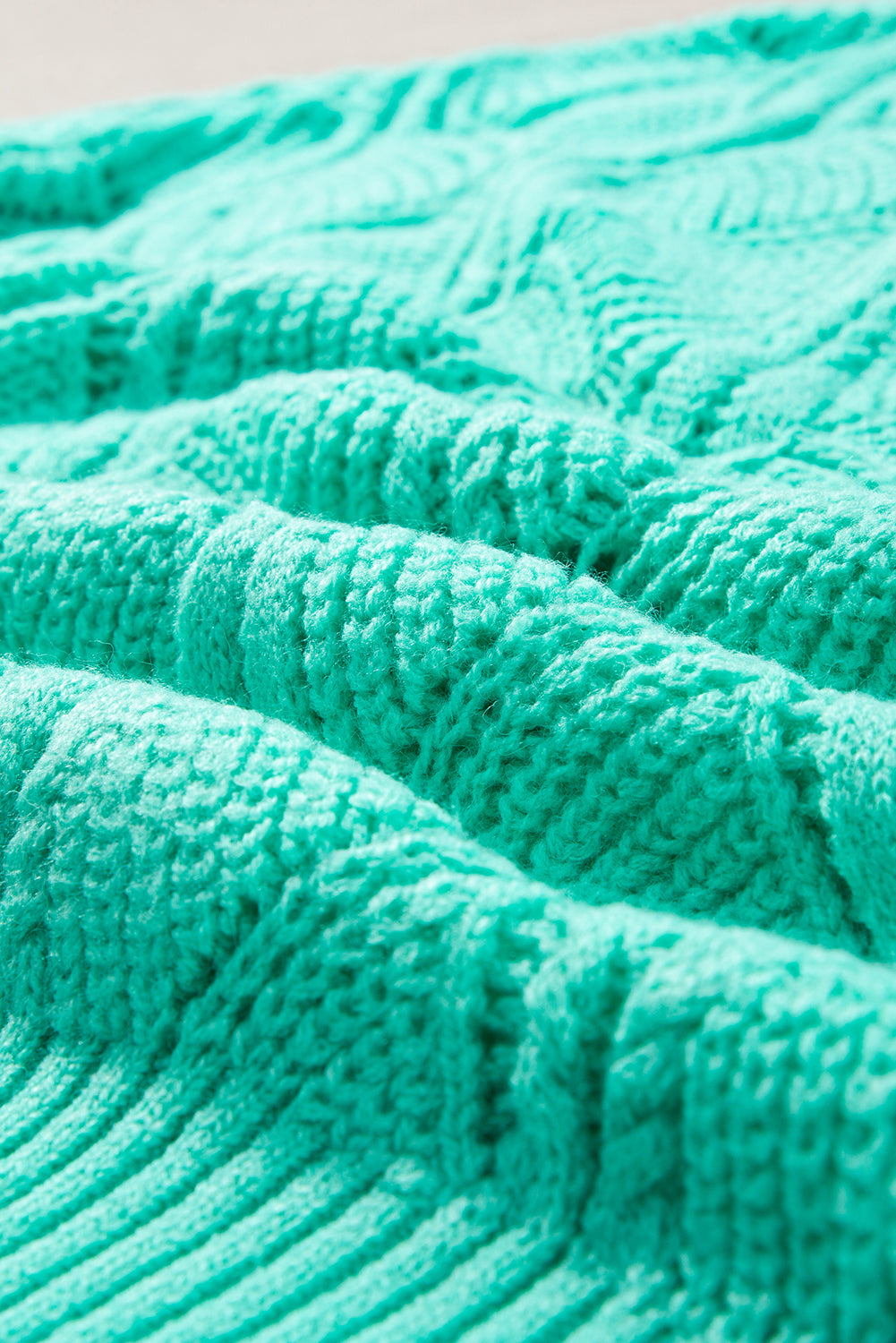 Close-up of a textured teal fabric