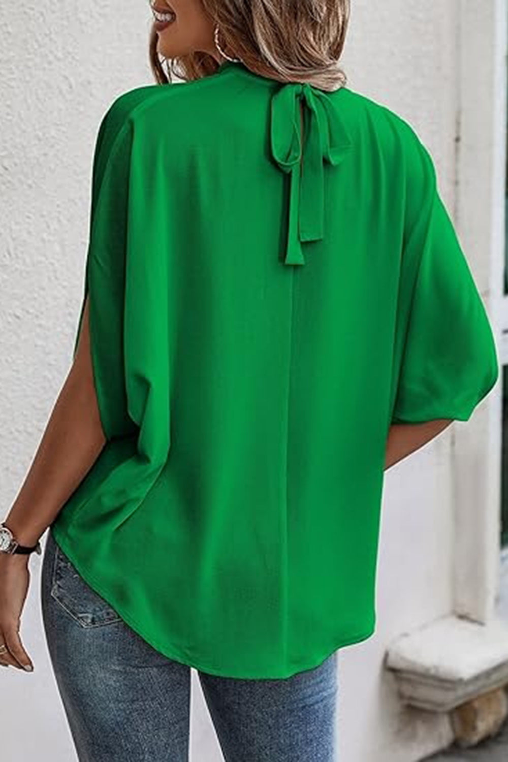 Back view of a model wearing an Exquisite Women's Green Tie Back Slit Half Sleeve Blouse