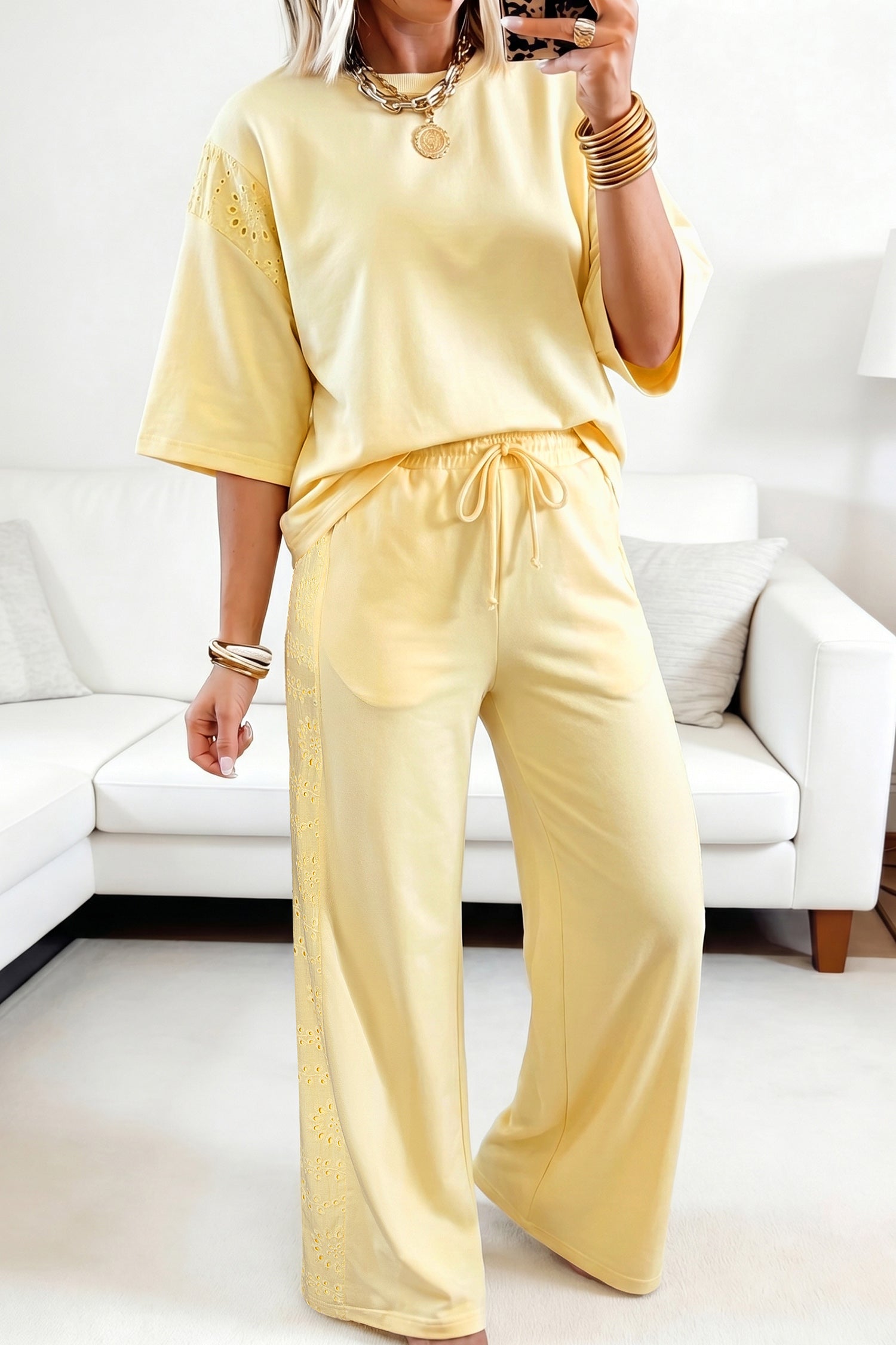 Person wearing a yellow outfit in a living room setting