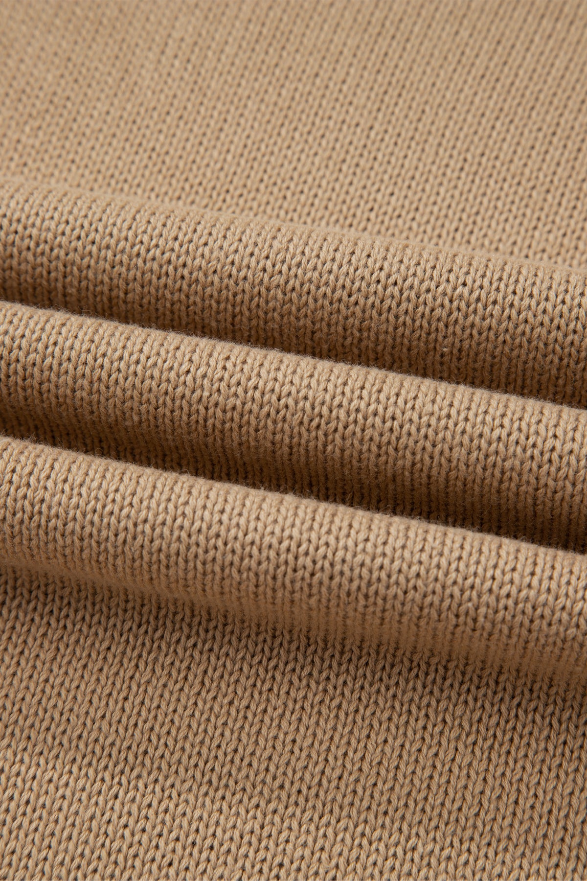 Close-up of a Women's Khaki Exposed Seam Mini Sweater Dress textured pattern