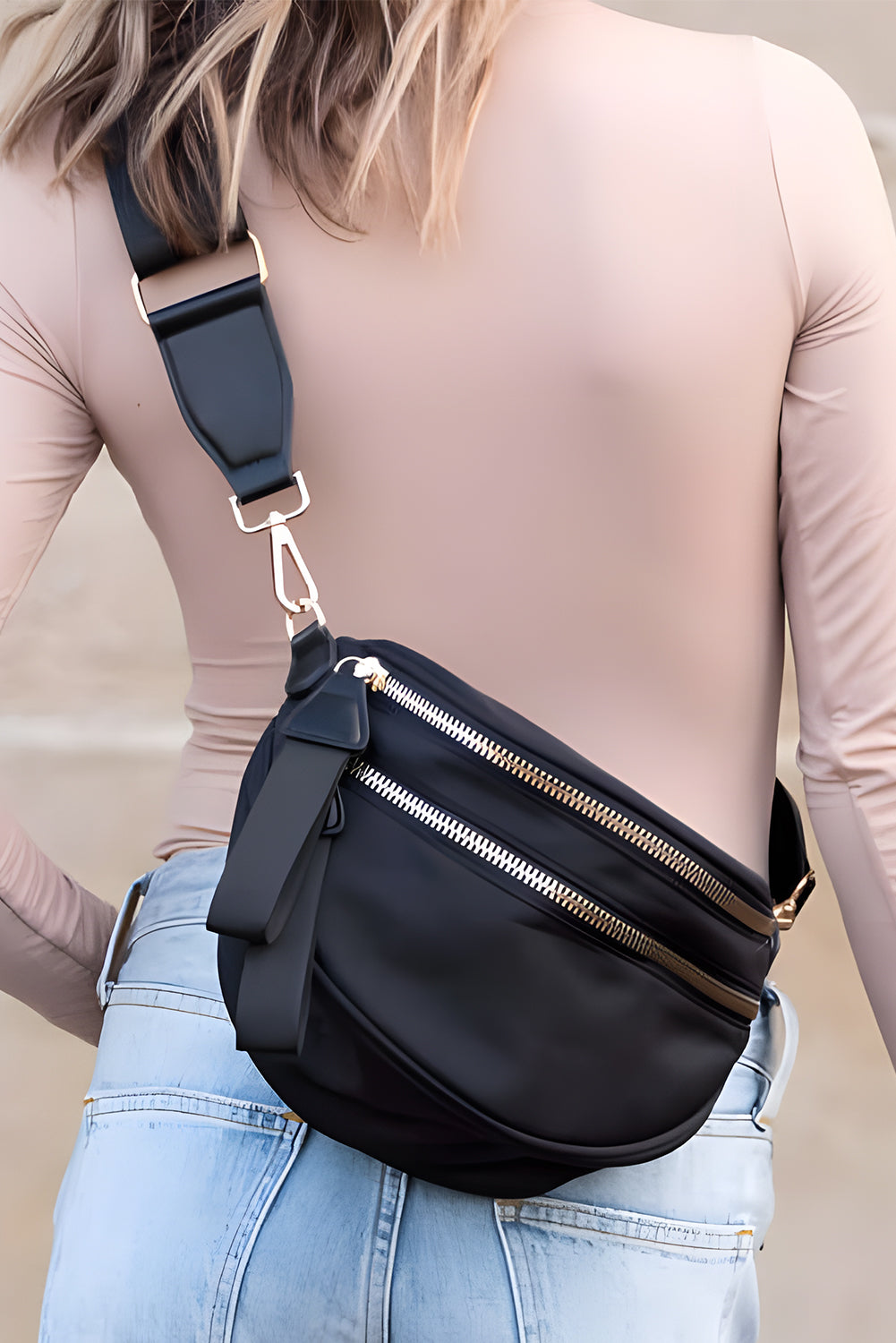 Model wearing a Women's black Chic & Comfy Wide Strap Crossbody bag across the back
