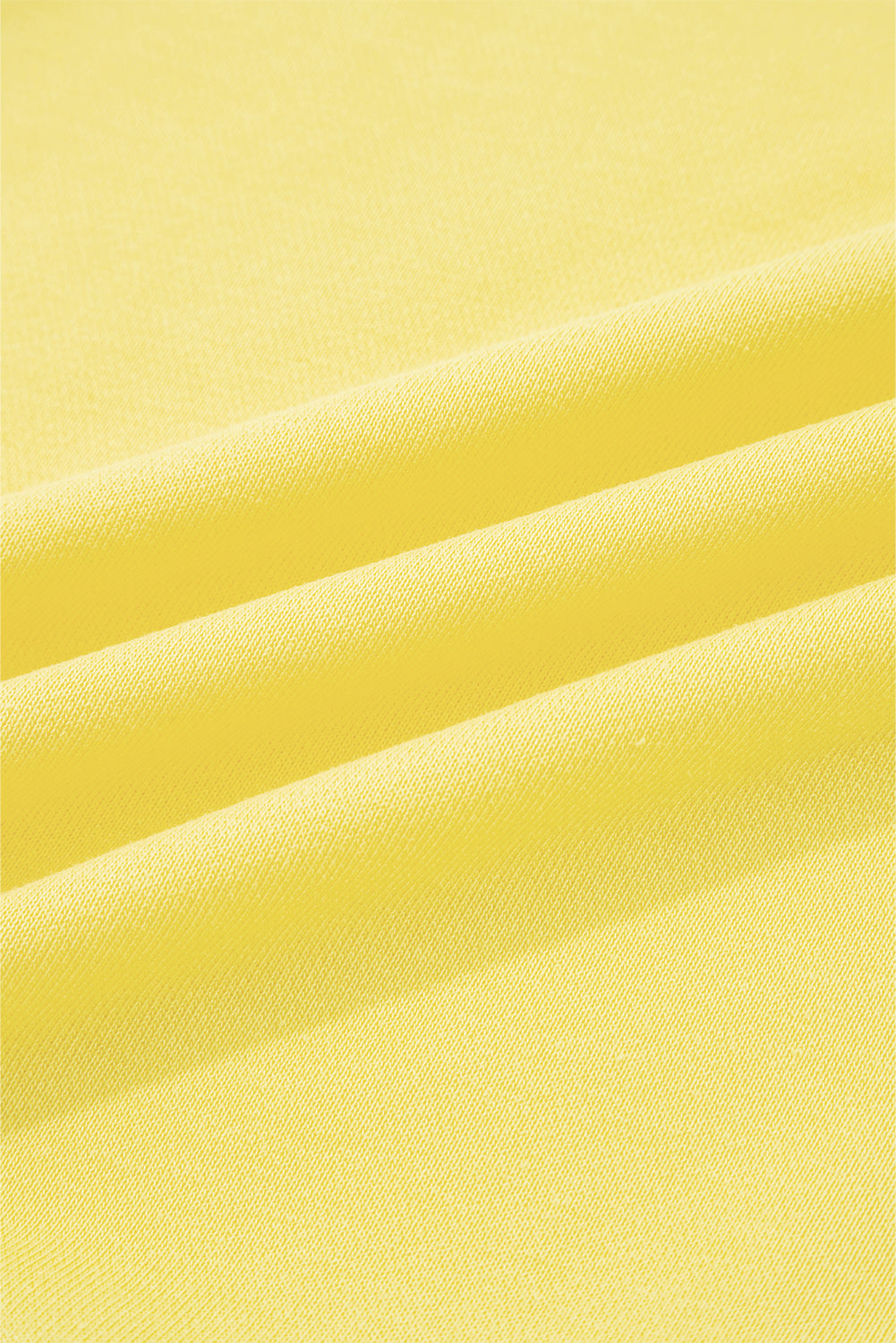 Close-up of yellow fabric with folds