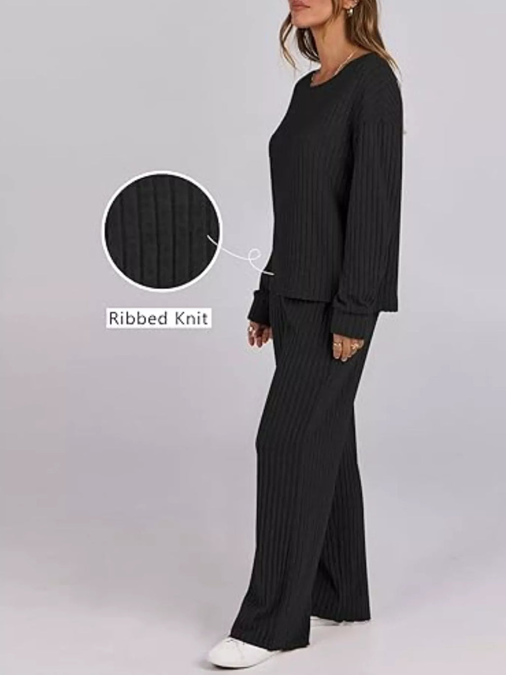 Woman wearing a black ribbed knit outfit with close-up of texture on a gray background