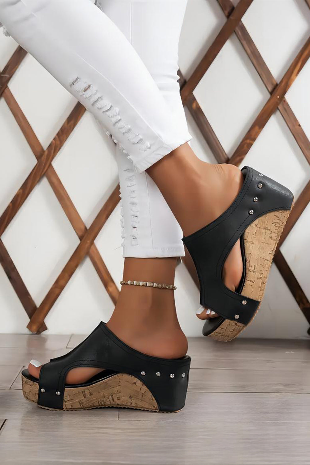 Model wearing Black wedge sandals with cork sole