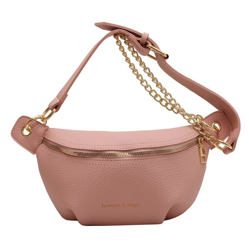Pink waist bag with gold chain strap on a white background