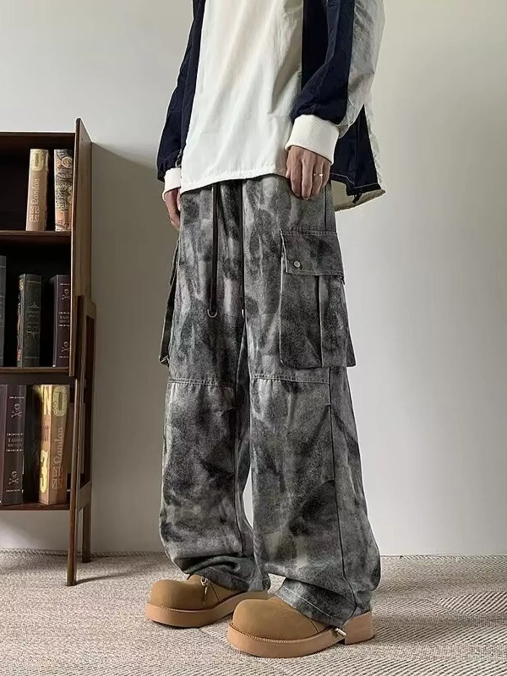 Model wearing black/grey Men's Tie-dye Loose Fit Cargo Jeans right side view