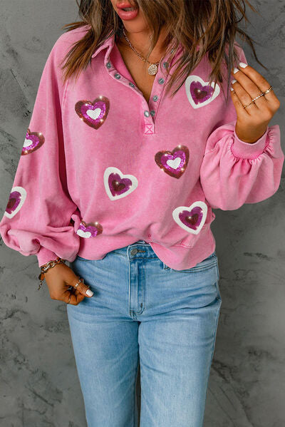 Get ready to steal hearts this Valentine's Day with our Ladies Valentines Heart Sequin Half Snap Sweatshirt! This playful sweatshirt features a stylish half snap design with a heart-shaped sequin embellishment. Stay cozy and stand out with this unique and eye-catching top. You'll love it (and more importantly, they will too!)