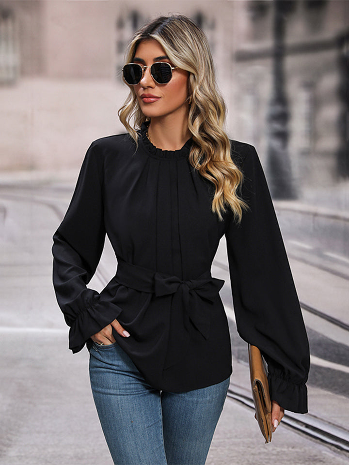 This round neck waist tie blouse is perfect for many occasion. This blouse features tie waist and stylish silhouette makes it ideal for a sophisticated look.