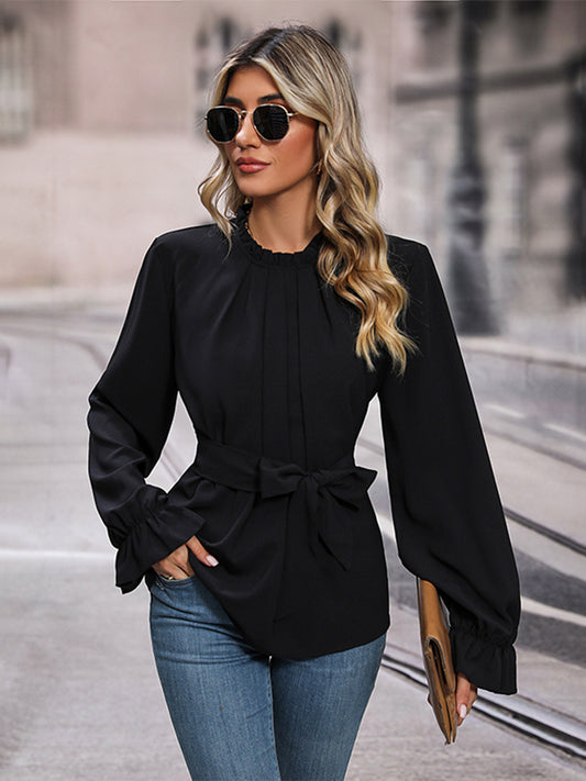 A model wearing a black Stylish Women's Waist Tie Long Sleeve Blouse