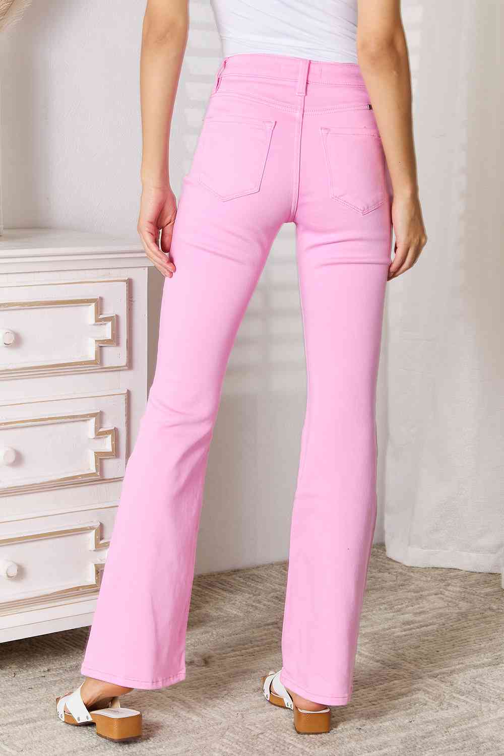 Back View of Model wearing Chic Kancan High Rise Carnation Pink Bootcut Jeans