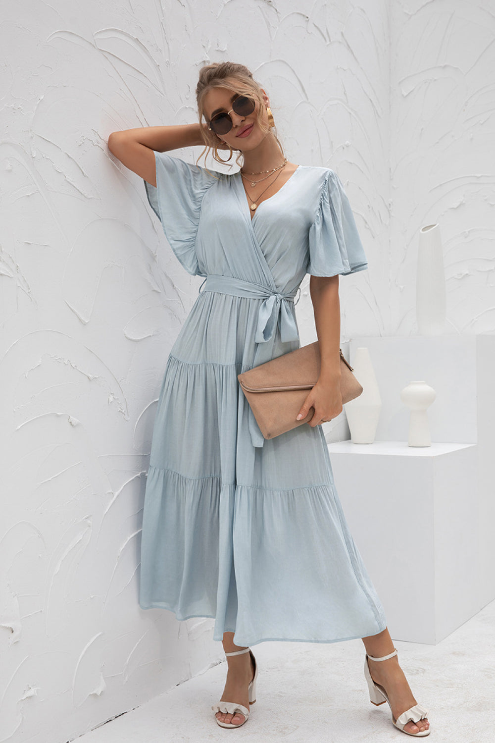 Women's Stylish Baby Blue Flutter Sleeve Wrap Front Tie Dress styled with accessories