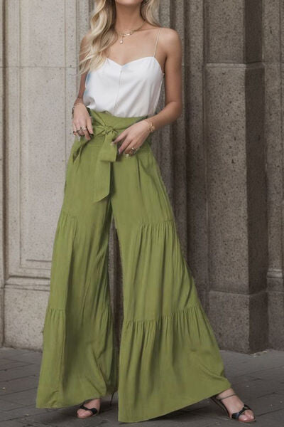 Indulge in effortless elegance with a pair of Elegant Women's Casual Tied Wide Leg Pants. Crafted with sophistication in mind, these pants exude refined style while offering ultimate comfort. The tied waist detail adds a touch of charm, elevating your casual ensemble to new heights. With their wide-leg silhouette, they create a graceful and flattering drape, perfect for any occasion. 