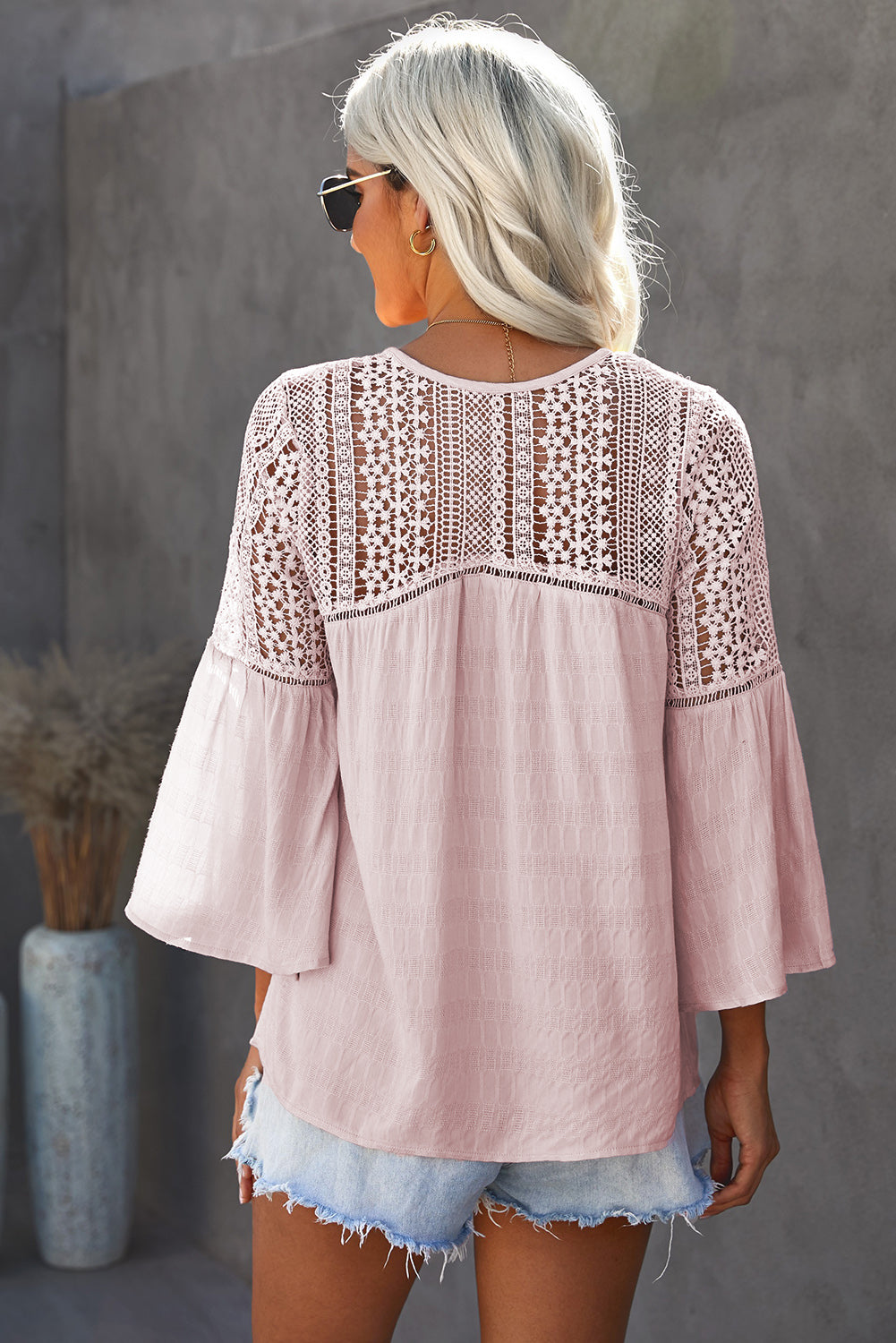 Back view of a Model wearing a Blush Pink Stylish Flare Women's Sleeve Lace V-Neck Shirt 