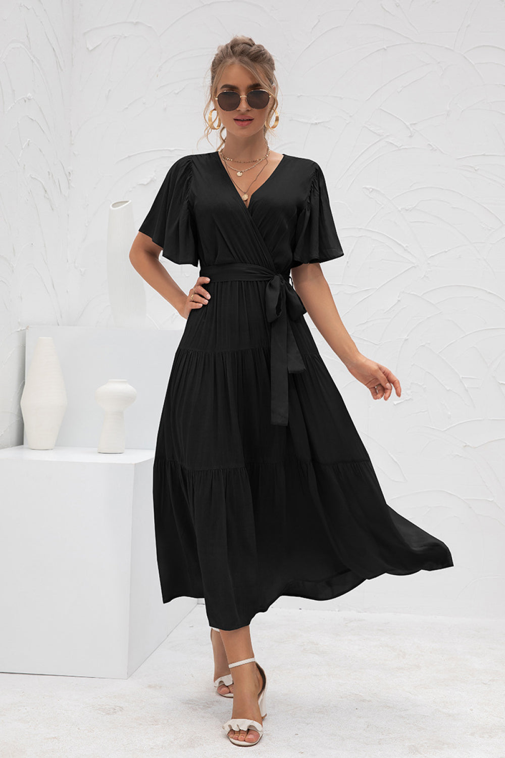 Model wearing Black Women's Stylish Flutter Sleeve Wrap Front Tie Dress