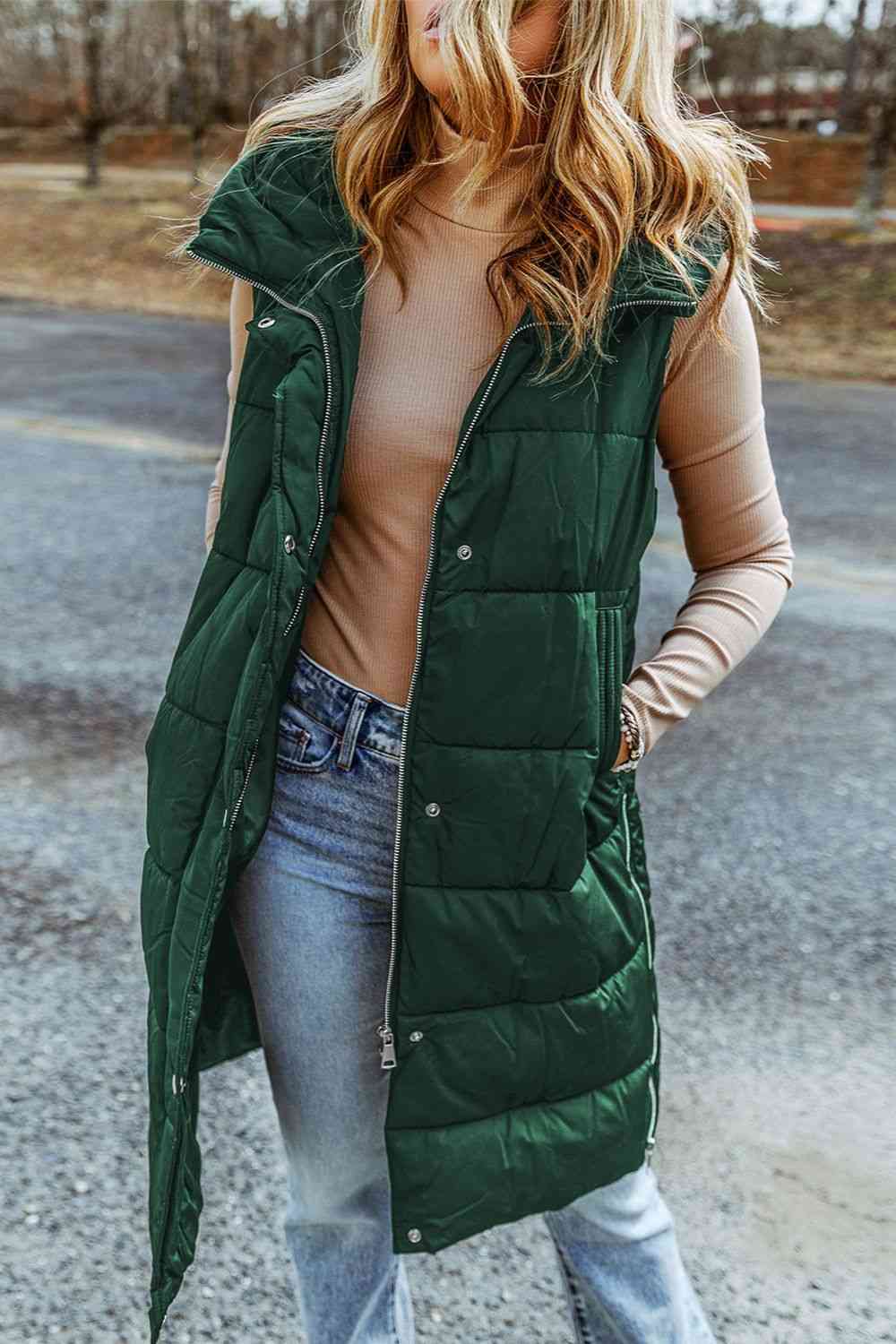 A model wearing a Green Women's Posh Sleeveless Longline Hooded Puffer Vest