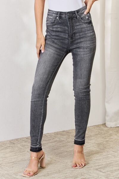 Step into confidence with our Women's Judy Blue Tummy Control Hem Skinny Jeans. Crafted for the confident woman, these jeans feature a high-waisted design that not only flatters your figure but also provides exceptional tummy control, so you can rock your look with ease.