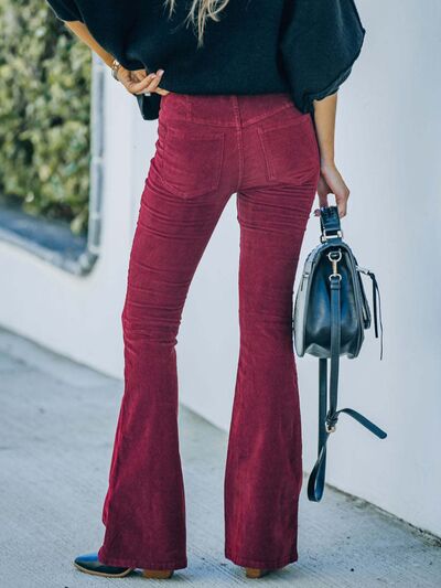 Model wearing Stylish Ladies High Waist Bootcut Pants back view