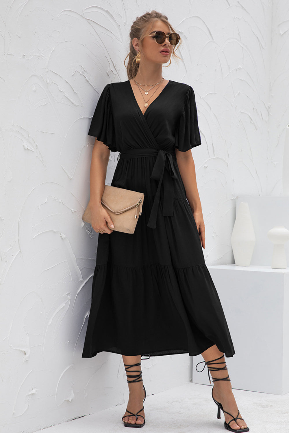 Women's Stylish Flutter Sleeve Wrap Front Tie Dress styled with accessories