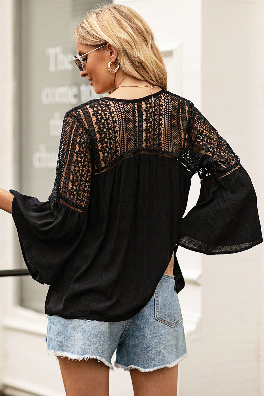 Back view of a Model wearing a Black Stylish Flare Women's Sleeve Lace V-Neck Shirt 