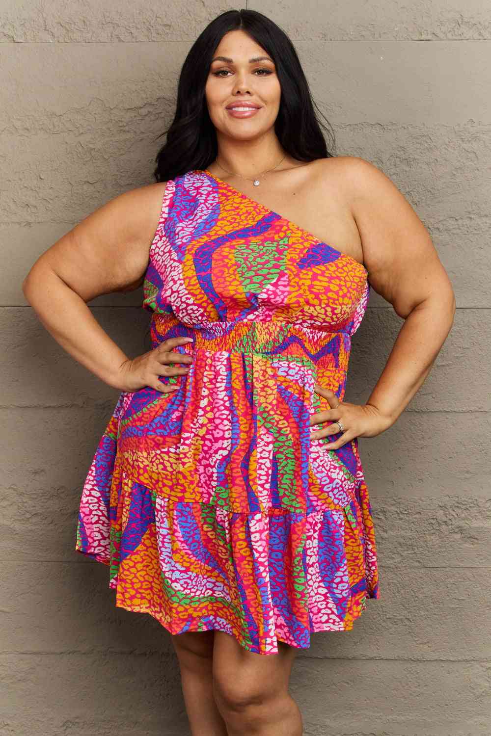 Elevate your style with the Hailey & Co Fall Back Plus Size Mini Tiered Dress, showcasing chic trends. Flaunt a flattering one-shoulder design paired with a smocked bodice for a beautifully accentuated silhouette. The flowy, tiered mini skirt adds a touch of fun and flirty flair, perfect for casual outings and special occasions alike. Experience all-day comfort and timeless style with this must-have dress.