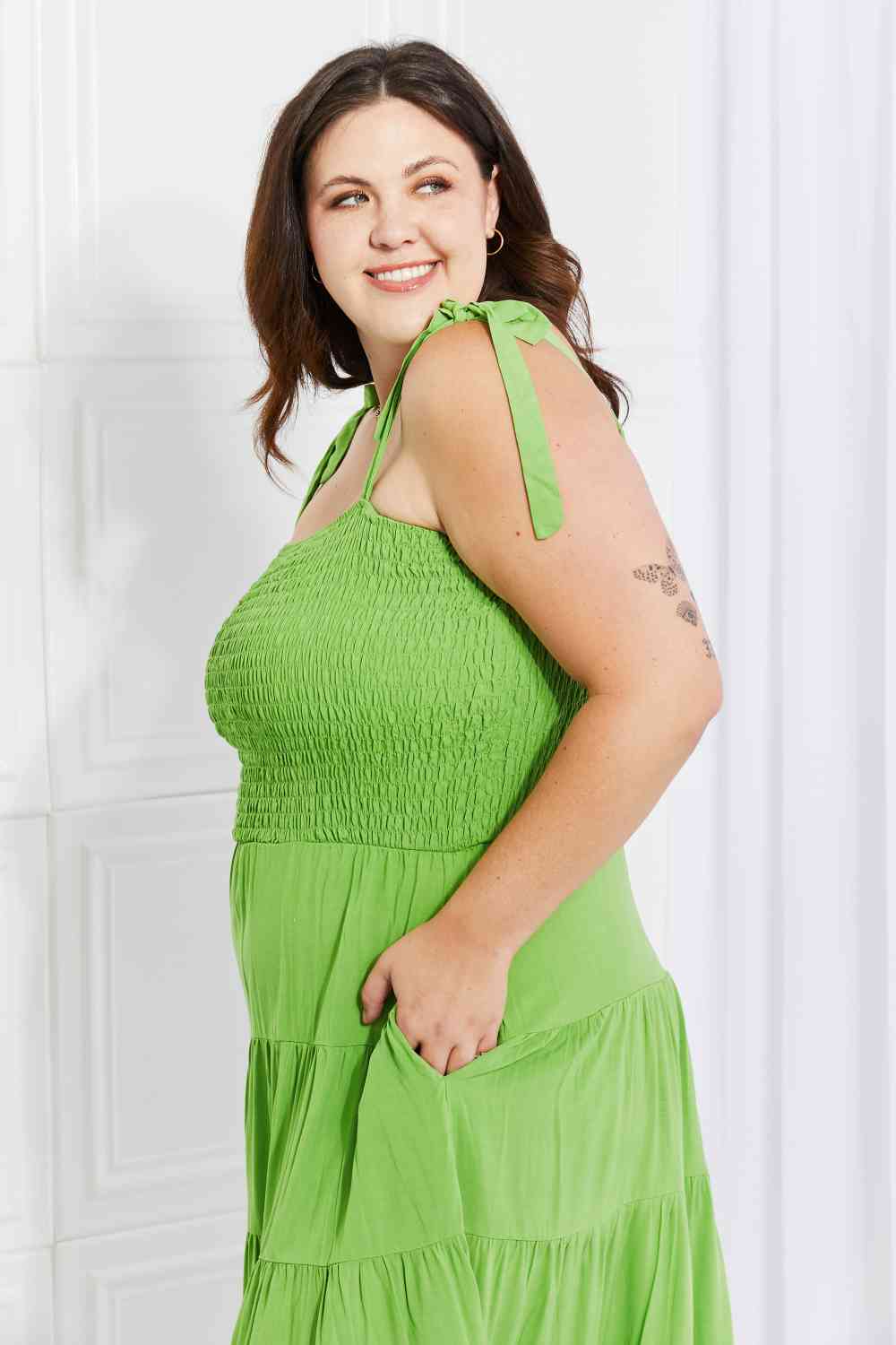 Plus size Model wearing a Lime Ladies Culture Code Summer Solstice Smocked Tiered Dress Side View