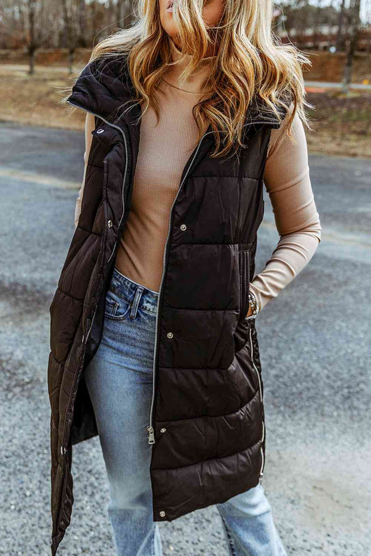 Blending classic and modern designs, this women's puffer vest is tailored to perfection. It features a longline silhouette, a hood, and sleeveless construction. 