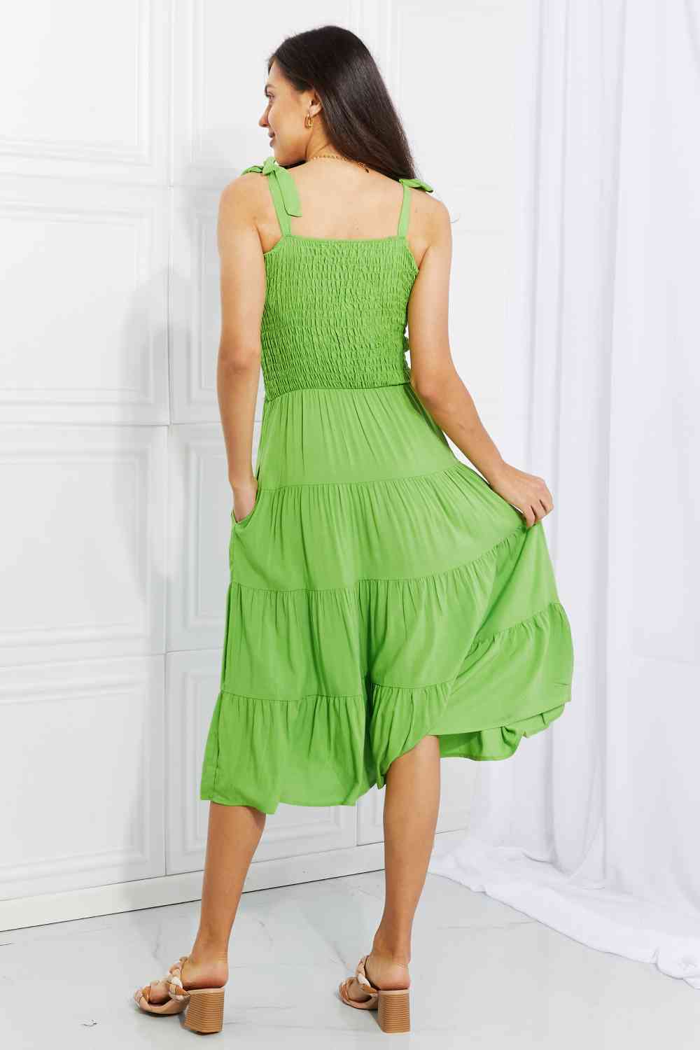 Model wearing a Lime Ladies Culture Code Summer Solstice Smocked Tiered Dress Back View