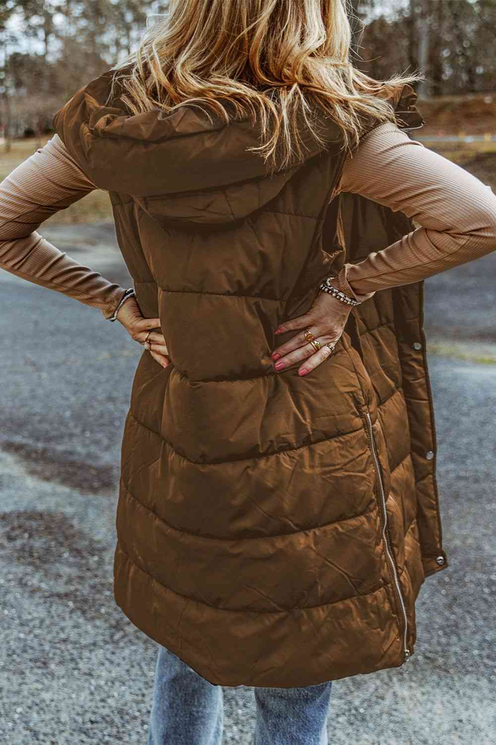 Back view a model wearing a Chestnut Women's Posh Sleeveless Longline Hooded Puffer Vest