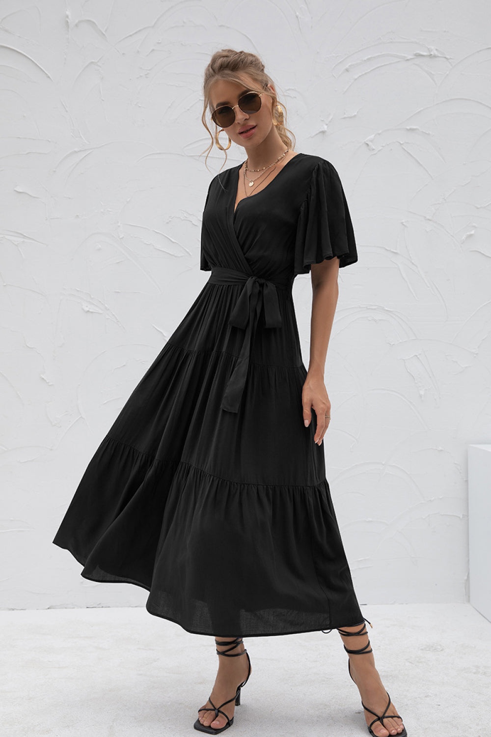 Model wearing Black Women's Stylish Flutter Sleeve Wrap Front Tie Dress