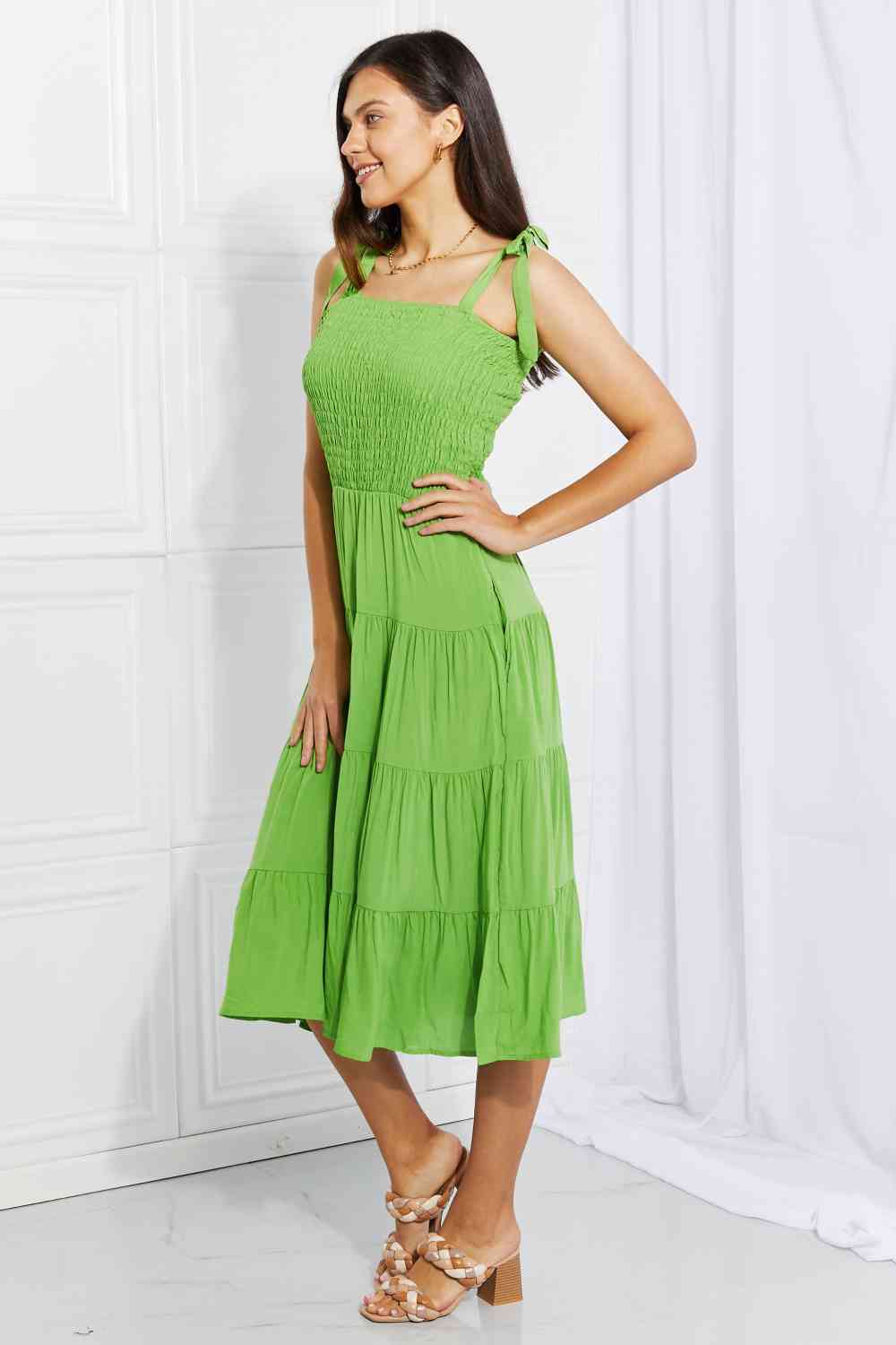 Model wearing a Lime Ladies Culture Code Summer Solstice Smocked Tiered Dress Side View 