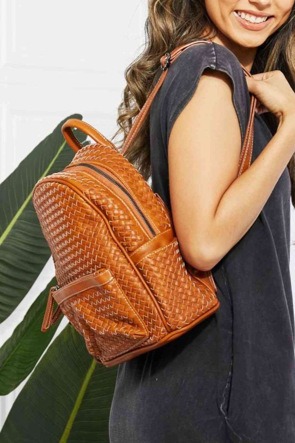 Model wearing SHOMICO Certainly Chic Faux Leather Woven Backpack side view