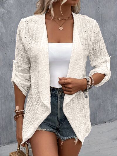 Introducing our Ladies Eyelet Roll-Tab Sleeve Cardigan, the perfect blend of fashion and function. Made with delicate eyelet fabric and versatile roll-tab sleeves, this cardigan is a must-have for any stylish woman. Elevate your wardrobe with this luxurious and exclusive piece.